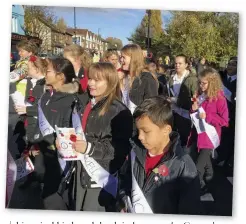  ??  ?? Children wear sashes with soldiers’ names at one of the parades