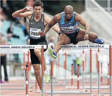  ?? / MICHAL CIZEK / AFP ?? Antonio Alkana blows past Damian Czykier of Poland on his way to the 110m hurdles title at the Josef Odlozil Memorial athletic meeting in Prague on Monday.