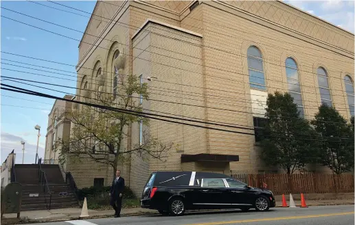 ?? (Reuters) ?? A HEARSE is parked outside the Berg Shalom Synagogue, before the funeral of Joyce Feinberg, one of the victims in last week’s synagogue shooting in Pittsburgh.