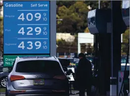  ?? JUSTIN SULLIVAN — GETTY IMAGES ?? A customer pumps gas into his vehicle at a Chevron station in Mill Valley on March 3. The cost of an average gallon of gasoline in California rose to $3.73 in the past week.