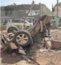  ?? HANI MOHAMMED/AP ?? People inspect the site of an airstrike by the Saudi-led coalition in Sanaa, Yemen.