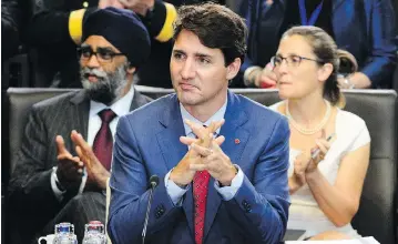  ?? SEAN KILPATRICK / THE CANADIAN PRESS ?? Prime Minister Justin Trudeau, Defence Minister Harjit Sajjan and Foreign Affairs Minister Chrystia Freeland take part in North Atlantic Council working session at the NATO summit in Brussels on Wednesday.