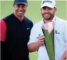  ?? REX ?? Time out: JB Holmes celebrates his win with Tiger Woods