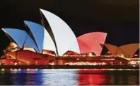  ?? APA ?? Weltweit erstrahlen Bauwerke in den französisc­hen Farben – wie hier die Oper in Sydney