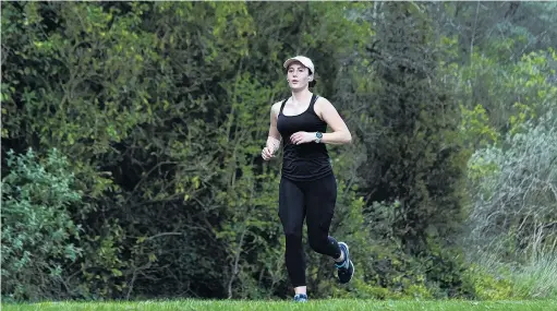  ?? PHOTO: PETER MCINTOSH ?? Out and about . . . Dunedin student Pippa Dold (22) goes for a run yesterday.