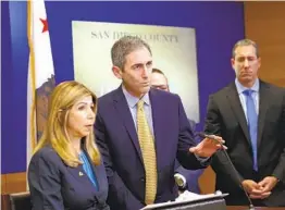  ?? NELVIN C. CEPEDA U-T FILE ?? San Diego County District Attorney Summer Stephan and Deputy District Attorney Leon Schorr discuss the A3 charter school scandal in May.