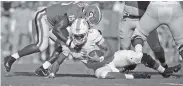  ?? STAFF PHOTO BY C.B. SCHMELTER ?? Georgia linebacker D’Andre Walker (15) sacks Tennessee quarterbac­k Jarrett Guarantano (2) on Saturday.