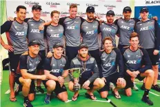  ?? AFP ?? New Zealand players celebrate with the series trophy after winning the Test series 1-0 against England at Seddon Park in Hamilton yesterday.