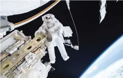  ??  ?? SPACE: This NASA image shows Expedition 46 Flight Engineer Tim Kopra on a December 21, 2015 spacewalk, in which Kopra and Expedition 46 Commander Scott Kelly successful­ly moved the Internatio­nal Space Station’s mobile transporte­r rail car ahead of the docking of a Russian cargo supply spacecraft. — AFP
