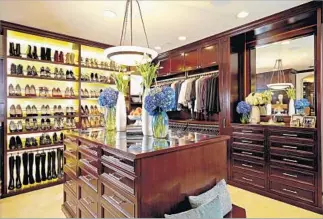  ?? LA Closet Design ?? THE GLAM way, above, by LA Closet Design includes lots of lighting fixtures and a staging area.