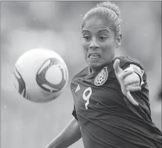  ?? PATRIK STOLLARZ/ AFP/ GETTY IMAGES ?? Maribel Dominguez, a 33- year- old forward on the Mexican women’s soccer team, faces the task of keeping her youthful players’ emotions in check and leading them to the 2012 Olympics in London.