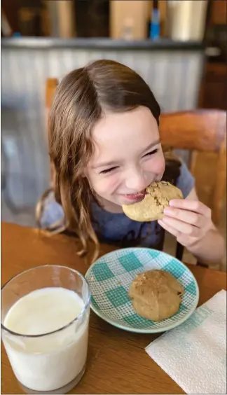  ?? KIMBERLY MARSELAS — SPECIAL TO MEDIANEWS GROUP ?? Gwen Graham, 7, enjoys Applesauce Cookies.