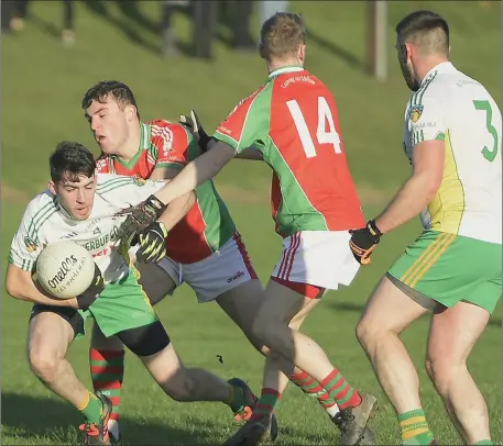  ??  ?? Jack Daly wins the ball for Boherbue against Carrig na bhFear in the County JAFL semi-final at Donoughmor­e. Photo by John Tarrant