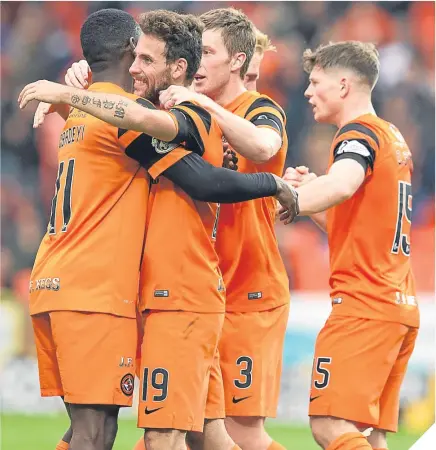  ??  ?? Dundee United’s Tony Andreu (second left) celebrates scoring the opening goal.