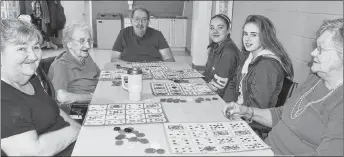  ?? SUBMITTED/KIMBERLY DICKSON ?? Glen Haven residents, from the left, clockwise, Linda Mayo, Clara Teed, John Swift and Rhoda MacKenzie are pictured enjoying bingo as part of the W.A. MacLeod Consolidat­ed School Socializin­g with Seniors Explorator­y Program with students Laila MacRae...