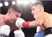  ?? CLYDE MUELLER/NEW MEXICAN FILE PHOTO ?? Brandon Holmes, right, got a technical knockout against Eric Gonzalez last year. Pat Holmes Sr., Brandon’s father, trainer and manager, said he is negotiatin­g with El Paso’s Juan Carlos Guillen to fight his son, Jan. 28, at the Buffalo Thunder Resort &...