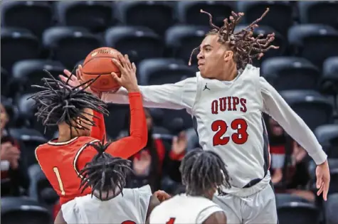  ?? JJ LaBella/For the Post-Gazette ?? Aliquippa’s Cameron Lindsey, right, blocks the shot of Northgate’s Landon Lockett in the WPIAL Class 2A championsh­ip Saturday at Petersen Events Center. Lindsey finished with 19 points and 17 rebounds as Aliquippa won, 52-40.