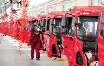  ?? — Reuters ?? A worker on an assembly line at a factory in Fuyang, Anhui province, China.