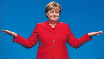  ?? — GETTY IMAGES ?? German Chancellor Angela Merkel addresses delegates during her Christian Democratic Union party’s congress in Essen, Germany, on Tuesday.