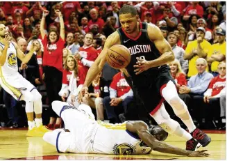  ?? GETTY IMAGES ?? With Houston ahead 96-94 and 3 seconds left, Rockets guard Eric Gordon makes a key steal against Warriors forward Draymond Green in Game 5 of the Western Conference finals Thursday.