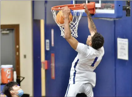  ?? KYLE FRANKO — TRENTONIAN PHOTO ?? Trenton Catholic’s Jameel Morris (1) averaged 11 points and 4.9 rebounds for a deep Iron Mikes squad this winter.