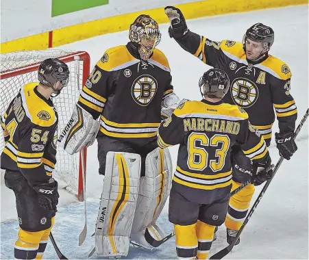  ?? STaFF PhOTO By MaTT STONE ?? GOOD ENOUGH: Adam McQuaid, Brad Marchand and Patrice Bergeron salute Tuukka Rask after the Bruins beat the Stars last night at the Garden.