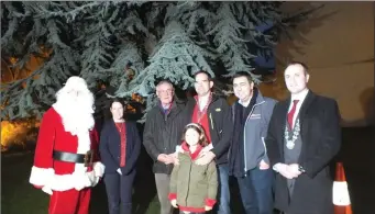  ??  ?? The Rotary group pictured at the Memorial Christmas tree in the grounds of St. Mary’s Church as the lights were switched on, on Saturday evening. Photo: Eugene Cosgrove