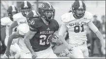  ?? NWA Democrat-Gazette/BEN GOFF @NWABENGOFF ?? Garrett Vaughan (20), Springdale High running back, runs the ball Aug. 14 during a scrimmage against Shiloh Christian at Jarrell Williams Bulldog Stadium in Springdale. Vaughan will lead the Bulldogs into the season-opener at home tonight against Joe T. Robinson.