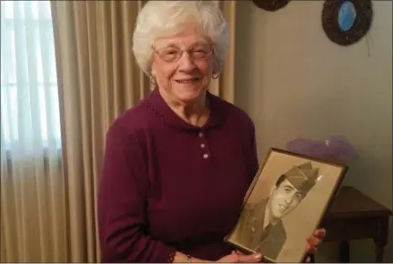  ?? KEITH REYNOLDS — THE MORNING JOURNAL ?? Darlene Bruno, 87, of Lorain, poses with a picture of her deceased husband, John Bruno.