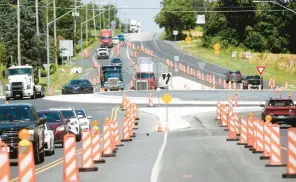  ?? UHRICH/READING EAGLE BILL ?? Traffic navigates the roundabout on Route 222 at Schaeffer Road, one of two traffic circles that PennDOT opened this spring between Route 73 and Berks Memorial Gardens cemetery in Maidencree­k Township.