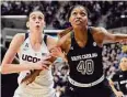  ?? Jessica Hill/Associated Press ?? UConn's Breanna Stewart and South Carolina's Jatarie White look for a rebound during the first half in 2015 in Storrs.