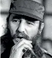  ??  ?? Then Cuban President Fidel Castro smokes a cigar during a meeting of the National Assembly in Havana, in this December 2, 1976 file photo.