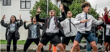  ?? GETTY IMAGES ?? Youngsters perform a haka during a students’ vigil near Al Noor Mosque on Monday.