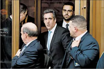  ?? EDUARDO MUNOZ ALVAREZ/GETTY-AFP ?? Former Trump lawyer Michael Cohen, whose office, home and hotel room were raided, exits court this year in New York.