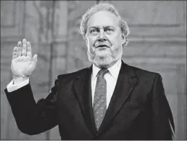  ?? ASSOCIATED PRESS 1987 ?? Judge Robert Bork, nominated by President Ronald Reagan to the Supreme Court, is sworn in at his confirmati­on hearing on Capitol Hill in 1987.