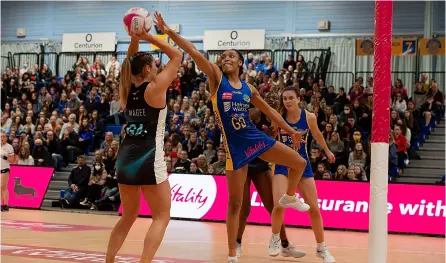  ?? PICTURE: Clare Green/matchtight ?? Team Bath Netball’s Layla Guscoth pressures Emma Magee during defeat against Surrey Storm