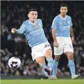  ?? ?? Phil Foden scores Manchester City’s fourth goal, and completes his hat-trick, during the 4-1 win over Aston Villa.