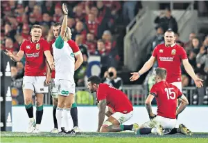  ??  ?? Controvers­y: Romain Poite awards the late penalty against Ken Owens (right) in the final Test with New Zealand – before changing his mind