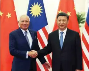  ?? XINHUA PIC ?? Chinese President Xi Jinping meeting Prime Minister Datuk Seri Najib Razak at the Belt and Road Forum for Internatio­nal Cooperatio­n in Beijing recently.