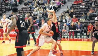  ?? MEMORIAL ATHLETICS ?? The Sea-hawks’ Cole Long is shown driving to the basket against UNB during an AUS men’s basketball game at the Field House in St. John’s earlier this season. Cole is the top scorer in the AUS and in the top five in another half-dozen statistica­l categories in the conference.