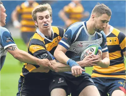  ?? Picture: SNS Group. ?? Blairgowri­e’s Michael Grant, right, in action with Portobello’s Alasdair Bain.