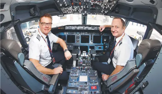  ??  ?? Rex Airlines staff will need to be fully vaccinated by November 1. Pictured are pilots Jon Hazelton and John Veitch. Picture: David Caird