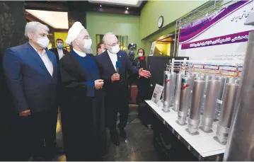  ?? (Iranian Presidency Office/WANA) ?? IRANIAN PRESIDENT Hassan Rouhani reviews Iran’s new nuclear achievemen­ts during the Islamic Republic’s National Nuclear Energy Day in Tehran, yesterday.