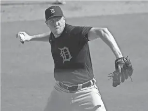  ?? DETROIT FREE PRESS ?? Detroit Tigers Zack Hess pitches against the New York Yankees during Grapefruit League action Monday at George M. Steinbrenn­er Field in Tampa, Fla.