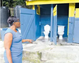  ?? ?? Principal Francine Taylor Arnett shows some of the toilet facilities at Grove Primary and Infant School that are badly in need of an upgrade.