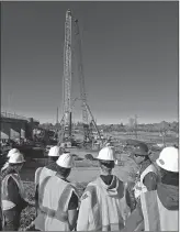  ??  ?? Sutter High School students visit the new Fifth Street Bridge project site for a tour with Paul Chang in Februray.