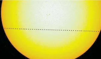  ?? NASA / New York Times ?? A time-lapse image by NASA shows the tiny dot of Mercury sliding across the sun during its transit in 2016. On Monday, Mercury will make another transit across the sun.
