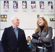  ?? Stephen Dunn / AP ?? Bob Hurley Sr., left, a legendary high school coach, talks with then University of Connecticu­t President Susan Herbst before his son, Dan Hurley, was introduced as the new men’s basketball coach at on March 23, 2018 in Storrs. Hurley’s two sons coach Division I men’s basketball teams — Dan at UConn and Bob at Arizona State.