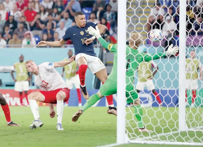  ?? — Reuters ?? France’s Kylian Mbappe scores their second goal.