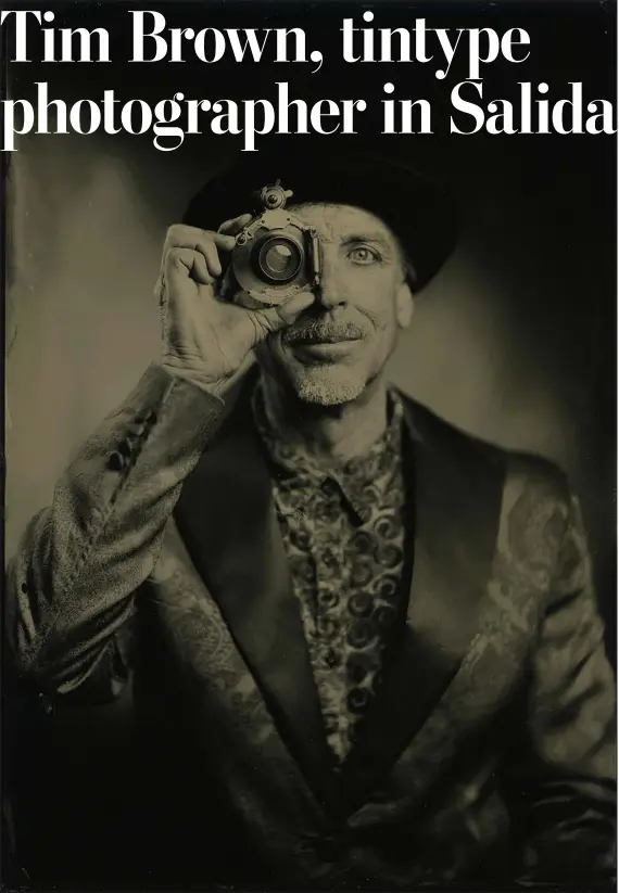  ?? HELEN H. RICHARDSON - THE DENVER POST ?? Tintype photograph­er Tim Brown peers through an old lens as he poses for a personal photograph in his studio on March 20in Salida, Colorado.